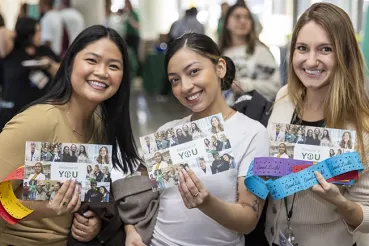 Smiling staff members at Rush Day celebration