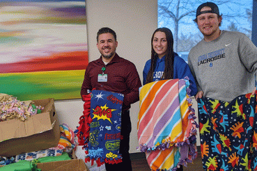 Aurora University student athletes donated blankets to Waterford Place Cancer Resource Center