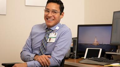 Carlos, manager of interpreter services at Rush University Medical Center, is a person with a disability.