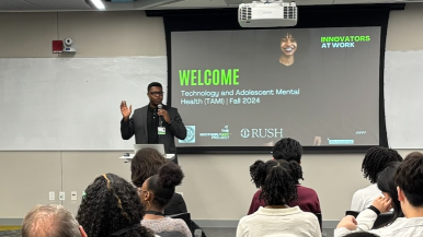 Chuka Emezue presents his research to a crowd.