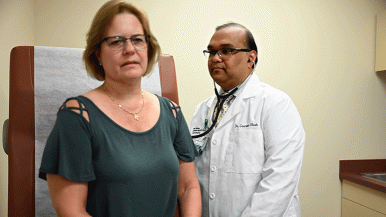 Cardiologist Gaurav Shah examines a patient