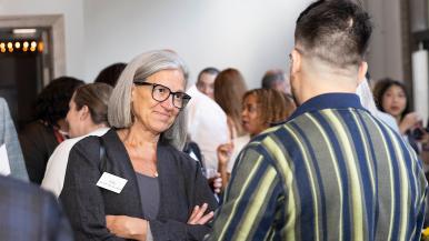 Julie Anne Hoff, PhD, RN, FNAP, FAAN, provost and senior vice president of Rush University, talks to someone at an event.