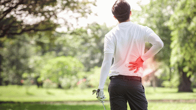 Golfer holding back