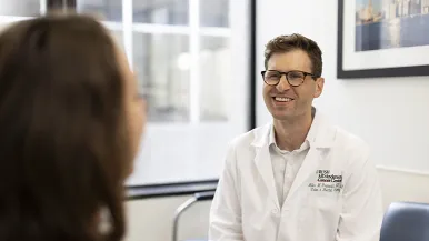 Dr. Grunvald talking with a patient