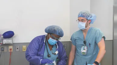 Two Rush nurses in scrubs