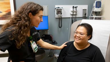 A nurse talks to a patient.