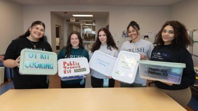 Occupational Therapy students pose with their occupation kits created for Rush Specialty Hospital.