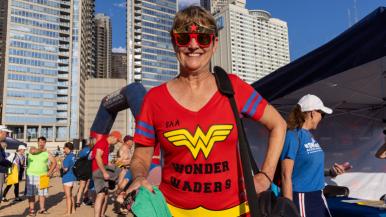 Patty Piasecki, NP, stands ready at Ohio Street Beach for the 2023 Swim Across America Chicago Open Water Swim in Lake Michigan, benefitting the RUSH Cancer Center.