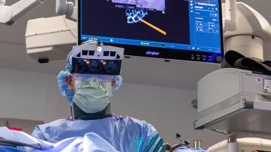 Spine surgeon using special imaging headset