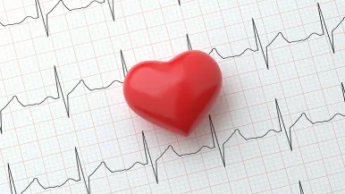 Heart symbol on top of an electrocardiogram readout