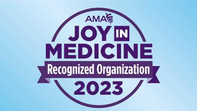 purple logo in front of a blue background that reads 'joy in medicine recognized organization 2023'
