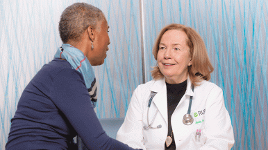 Melody Cobleigh, MD, with a patient