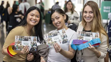 Smiling staff members at Rush Day celebration