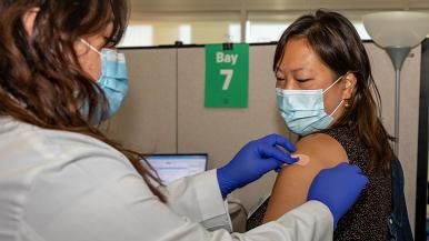 Rush staff member getting vaccinated