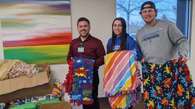 Aurora University student athletes donated blankets to Waterford Place Cancer Resource Center