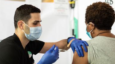 Nurse administering COVID vaccine