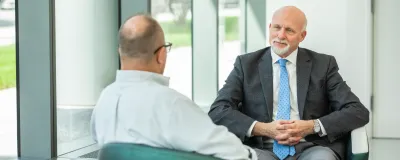 Steven Flamm, MD, transplant care talking with a patient.