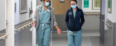 Two labor and delivery residents walk down the hall at RUSH
