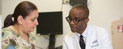 Philip Omotosho, MD, with patient