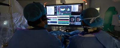 Experts at Rush Arrhythmia Center inspecting heart on computer software.