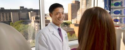 Urologic cancer doctor, Alan Tan, MD, with a patient. 