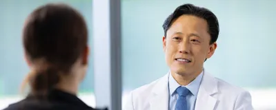 Dr. Chong with a patient