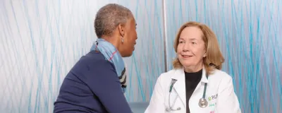 Dr. Cobleigh with a patient