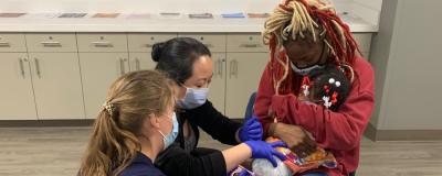 A child receiving a flu shot at a free vaccine clinic