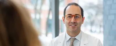 David Curlander consulting with a patient 