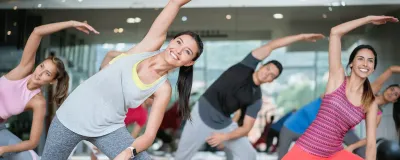 group of people stretching in fitness class
