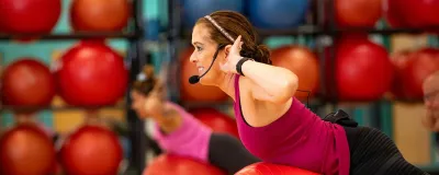 group class instructor using exercise ball