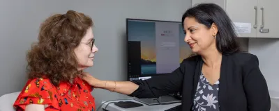 Dr. Soni talking to a patient