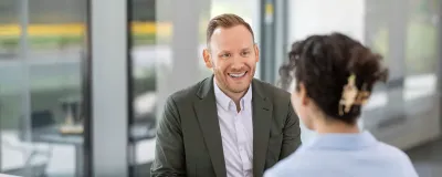 Ryan Nesemeier, MD, talking with patient