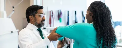 Ravi Kasi, MD, with patient