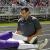 Dr. Patel treats player during high school football game