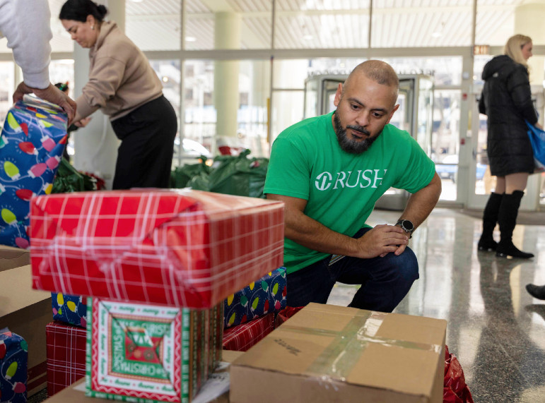 People wrapping gifts in the Rush Atrium building